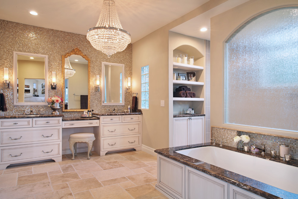 Inspiration for a huge transitional master beige tile and mosaic tile travertine floor doorless shower remodel in Orange County with an undermount sink, furniture-like cabinets, white cabinets, marble countertops, an undermount tub, a two-piece toilet and beige walls
