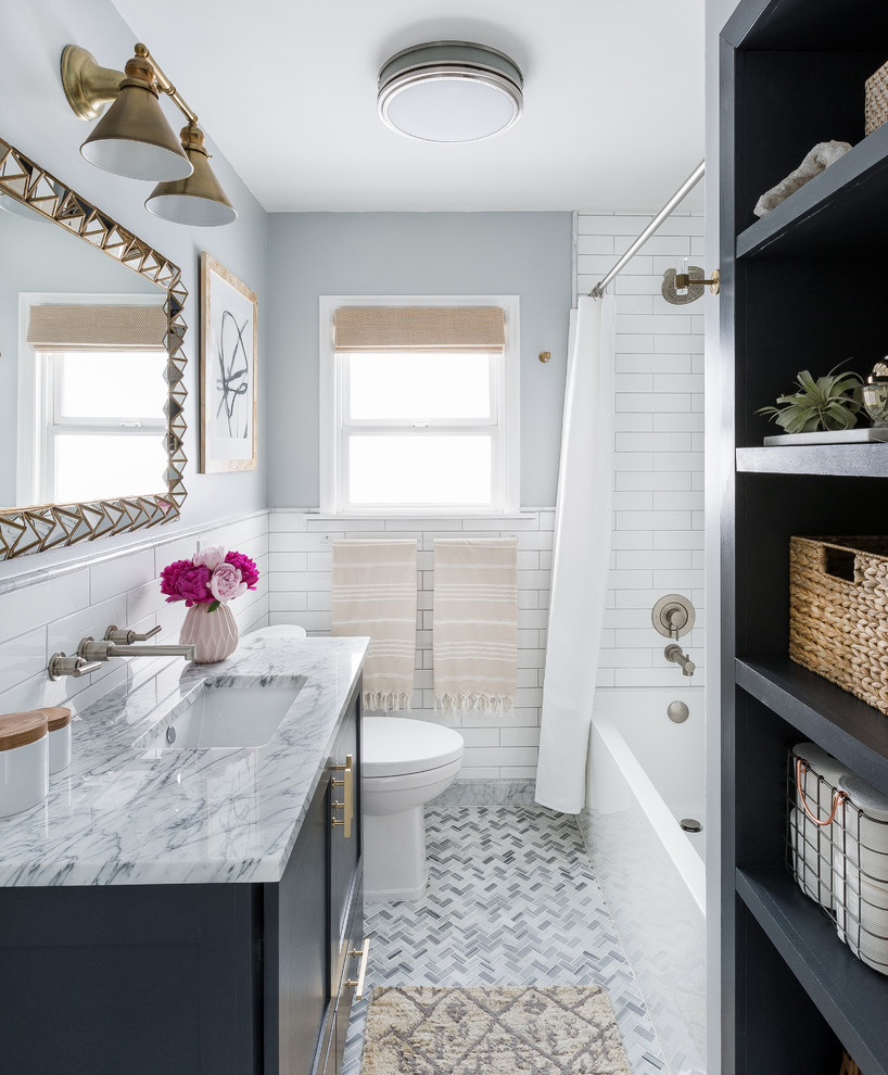 Inspiration for a transitional 3/4 white tile and subway tile marble floor and gray floor bathroom remodel in Seattle with shaker cabinets, black cabinets, gray walls, an undermount sink and marble countertops