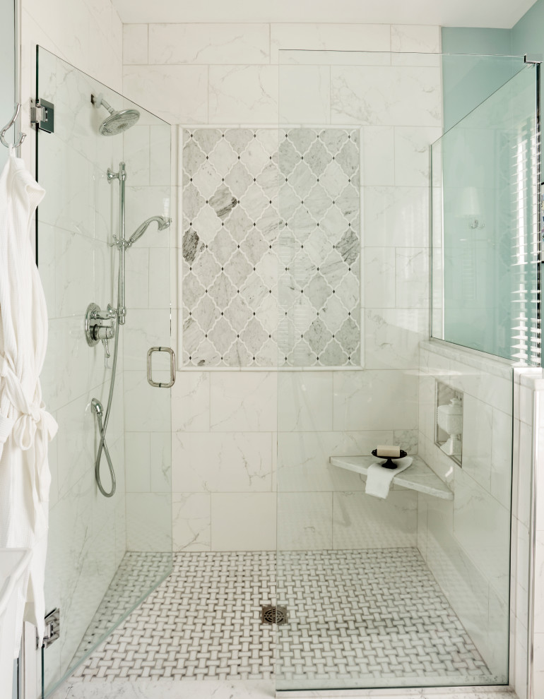 Photo of a large traditional ensuite bathroom in St Louis with freestanding cabinets, grey cabinets, a freestanding bath, a corner shower, a two-piece toilet, white tiles, mosaic tiles, blue walls, marble flooring, a submerged sink, marble worktops, white floors, a hinged door and white worktops.