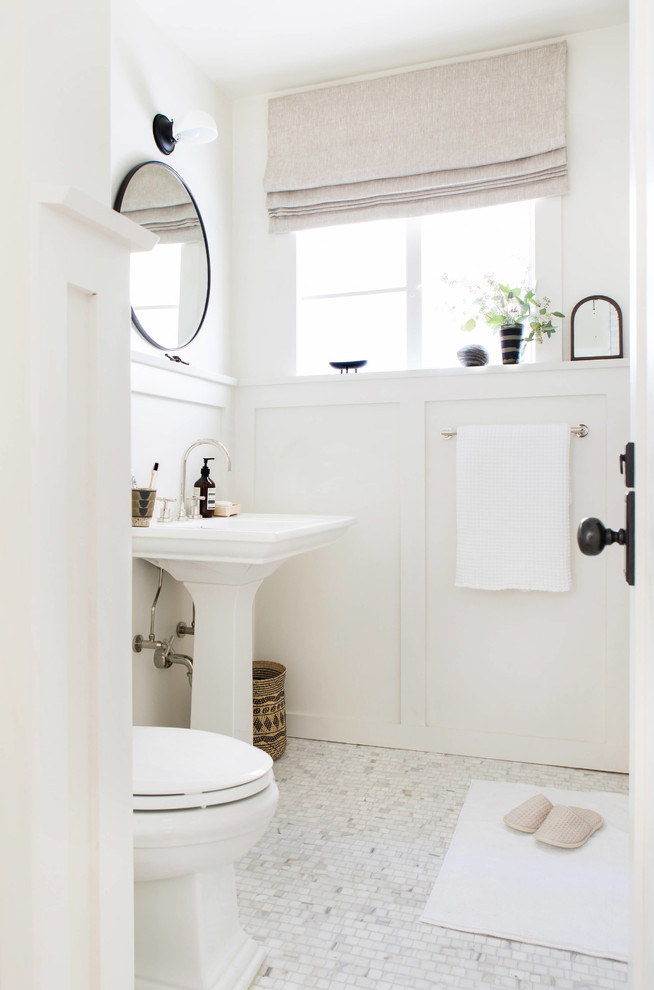 Bathroom - transitional master white tile and marble tile marble floor and white floor bathroom idea in New York with a one-piece toilet, white walls and a pedestal sink