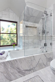 Big spacious bathroom with stand up shower, hot tub and marble