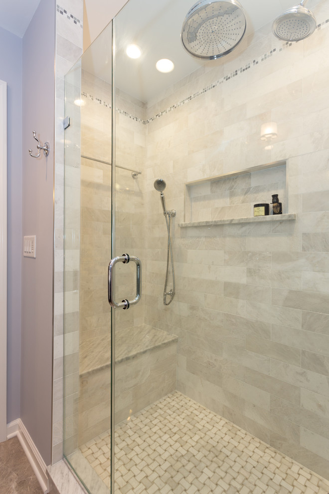 Large traditional ensuite bathroom in New York with a submerged sink, shaker cabinets, brown cabinets, marble worktops, an alcove shower, a two-piece toilet, white tiles, stone tiles, blue walls and marble flooring.