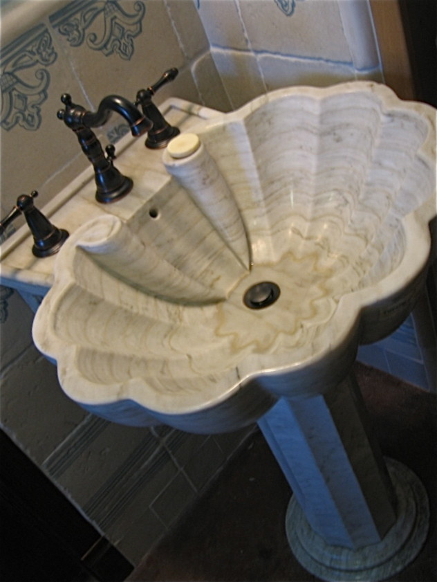 Marble pedestal sink in universal access bath with handmade tiles