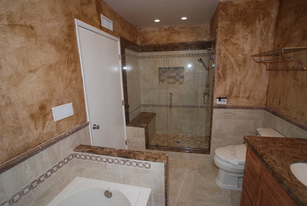 Mid-sized minimalist master beige tile and stone tile porcelain tile bathroom photo in Orange County with an undermount sink, flat-panel cabinets, medium tone wood cabinets, marble countertops, a two-piece toilet and brown walls