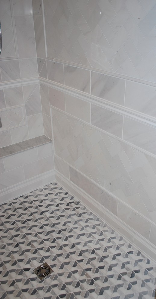This is an example of a medium sized classic shower room bathroom in DC Metro with an alcove shower, grey tiles, marble tiles, marble flooring, grey floors and a hinged door.