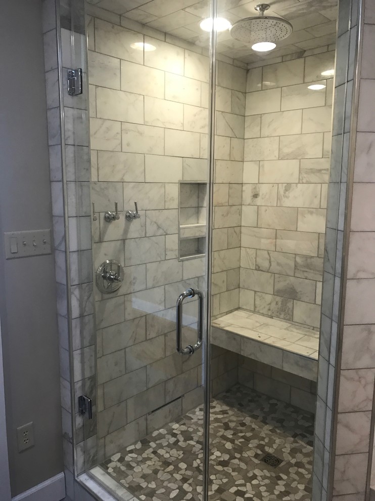Medium sized mediterranean ensuite bathroom in Atlanta with a corner shower, white tiles, stone tiles and a hinged door.