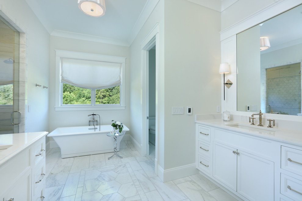 Example of a mid-sized country master multicolored tile and marble tile marble floor and multicolored floor bathroom design in Grand Rapids with recessed-panel cabinets, white cabinets, a two-piece toilet, beige walls, an undermount sink, quartz countertops, a hinged shower door and white countertops