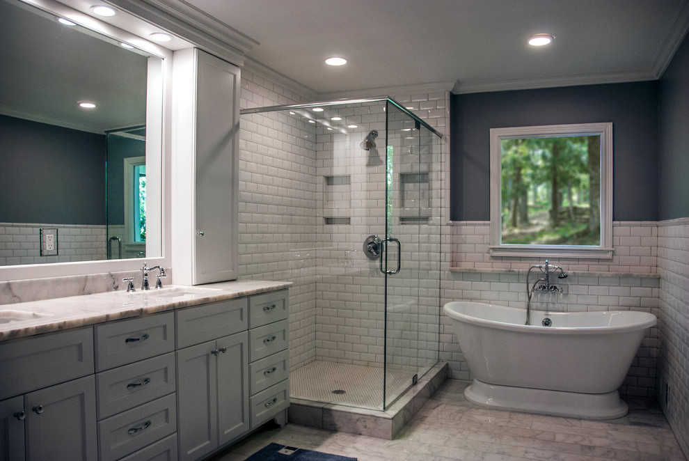 Large transitional master white tile and subway tile marble floor and gray floor bathroom photo in Atlanta with shaker cabinets, gray cabinets, gray walls, an undermount sink, marble countertops, a hinged shower door and gray countertops