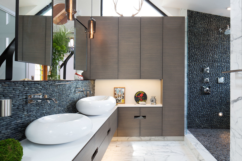 Bathroom - contemporary 3/4 stone tile marble floor and white floor bathroom idea in New York with flat-panel cabinets, brown cabinets, beige walls and a vessel sink