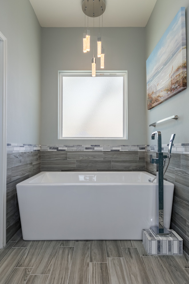 Mid-sized beach style master blue tile and porcelain tile porcelain tile bathroom photo in Austin with shaker cabinets, gray cabinets, gray walls, an undermount sink and quartz countertops