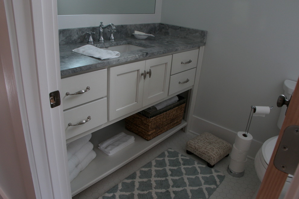 This is an example of a nautical shower room bathroom in Miami with a submerged sink, shaker cabinets, white cabinets, a submerged bath and a two-piece toilet.