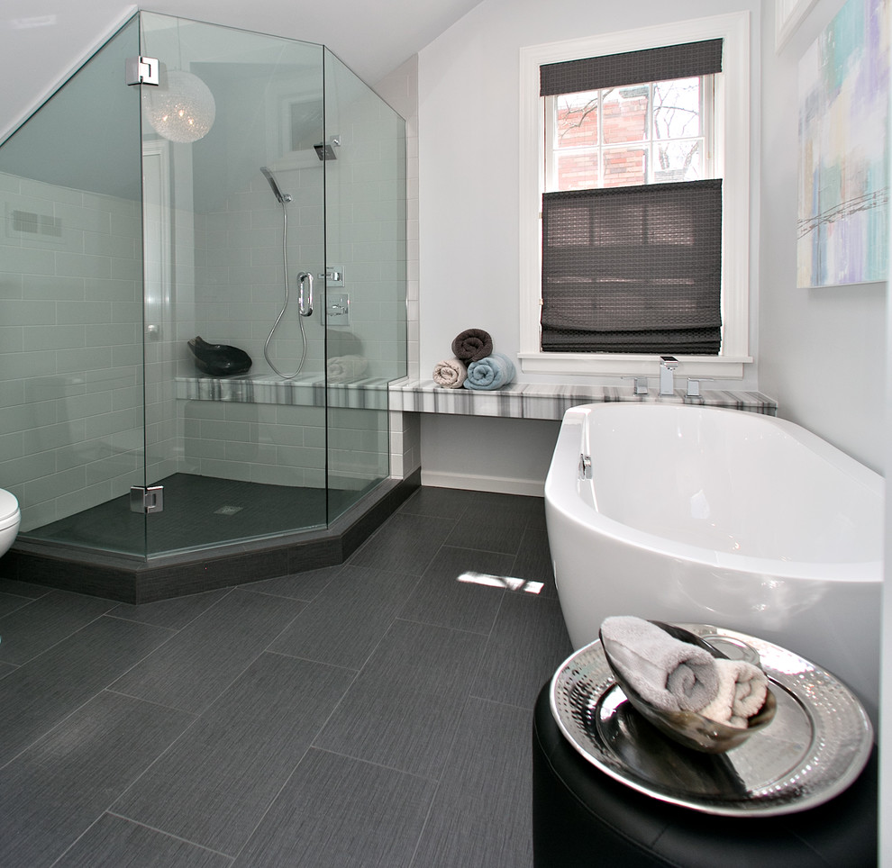 Inspiration for a medium sized contemporary ensuite bathroom in St Louis with a submerged sink, shaker cabinets, white cabinets, marble worktops, a freestanding bath, a corner shower, a two-piece toilet, black tiles, porcelain tiles, grey walls and porcelain flooring.