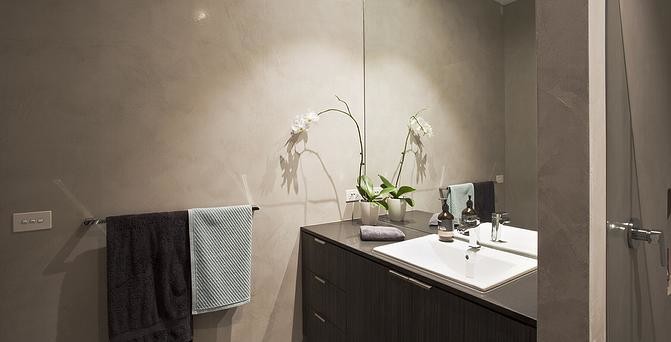 Diseño de cuarto de baño contemporáneo con paredes grises