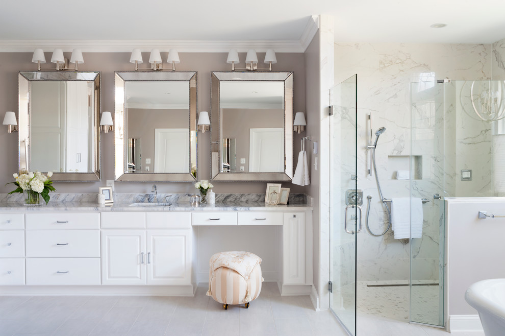 Example of a large transitional master gray tile and porcelain tile porcelain tile bathroom design in Chicago with raised-panel cabinets, white cabinets, a one-piece toilet, gray walls, an undermount sink and quartzite countertops