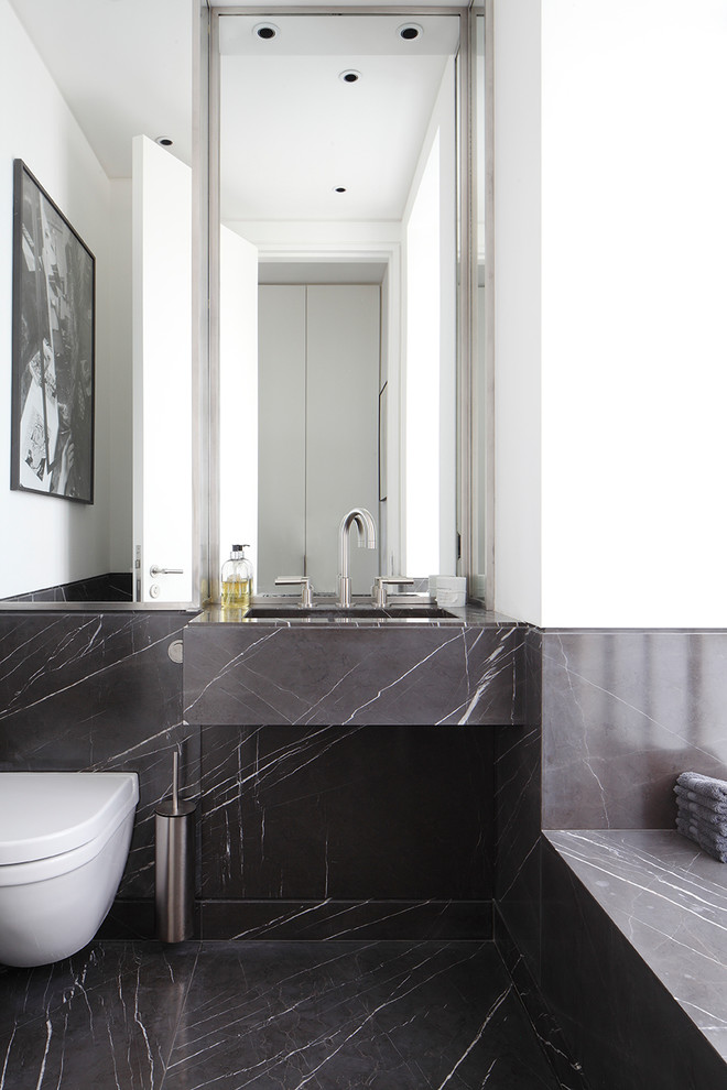 Design ideas for a medium sized contemporary ensuite bathroom in London with flat-panel cabinets, white cabinets, an alcove bath, a corner shower, grey tiles, marble tiles, white walls, marble flooring, a built-in sink, marble worktops, grey floors, a hinged door and grey worktops.