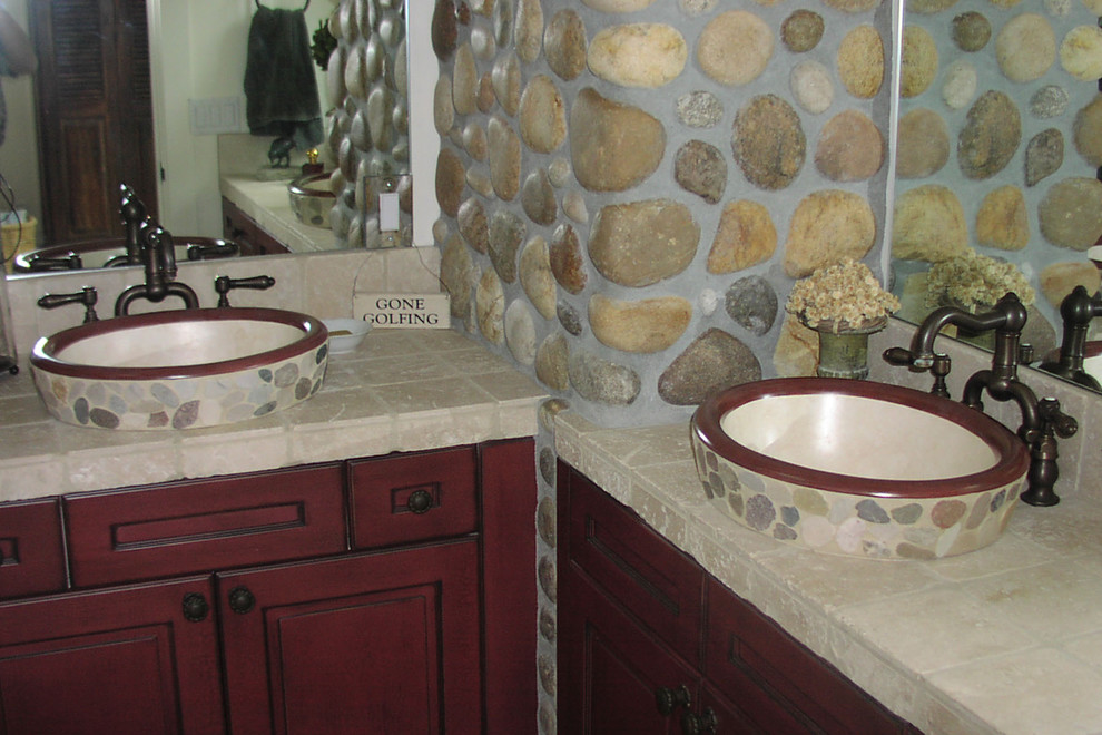 Arts and crafts stone tile bathroom photo in Other with a vessel sink