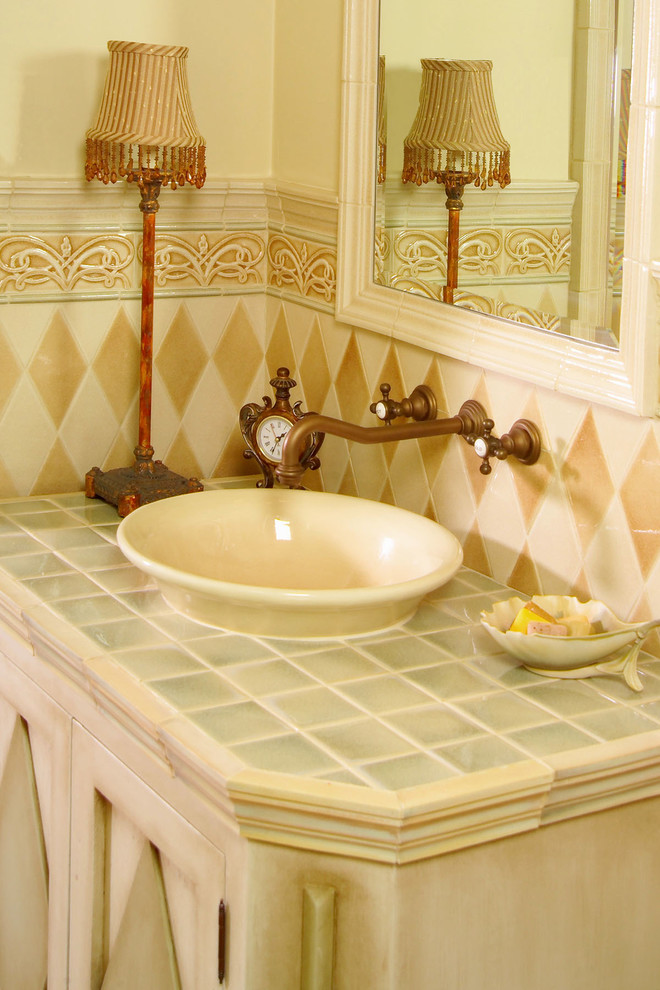 Example of a classic ceramic tile bathroom design in Other with a vessel sink, furniture-like cabinets and tile countertops