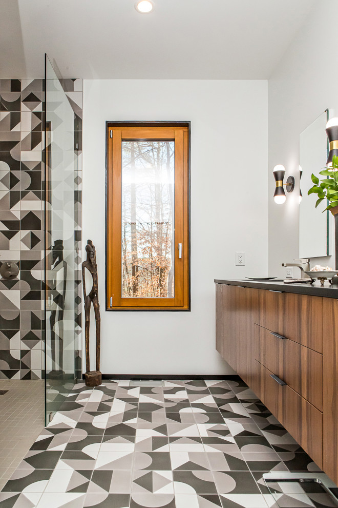 Bathroom - mid-sized 1960s master multicolored tile and ceramic tile ceramic tile and multicolored floor bathroom idea in Raleigh with flat-panel cabinets, dark wood cabinets, a two-piece toilet, gray walls, an undermount sink, quartz countertops and black countertops