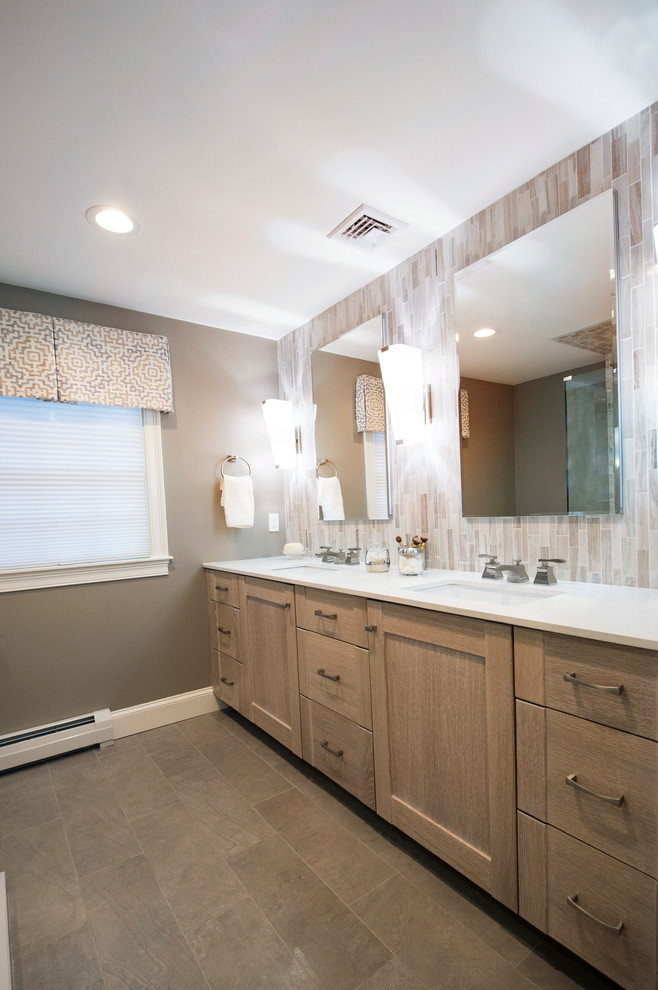 Design ideas for a large classic ensuite bathroom in Boston with flat-panel cabinets, white cabinets, a corner shower, a one-piece toilet, white tiles, glass sheet walls, brown walls, ceramic flooring, a submerged sink, beige floors and a hinged door.