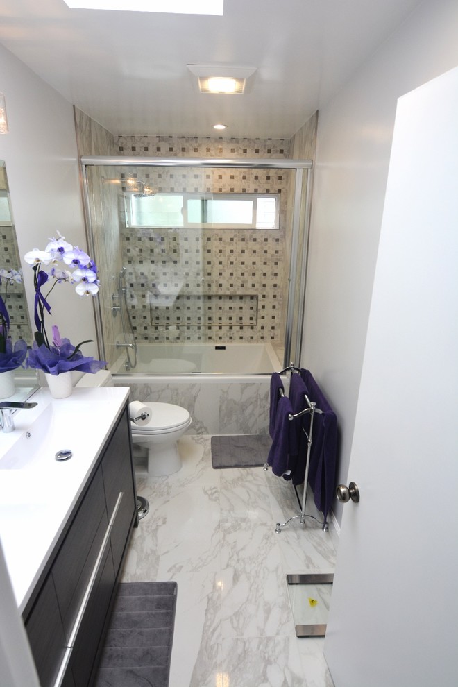 Example of a small minimalist master multicolored tile marble floor bathroom design in Los Angeles with beaded inset cabinets, dark wood cabinets, a one-piece toilet, white walls, a drop-in sink and quartzite countertops