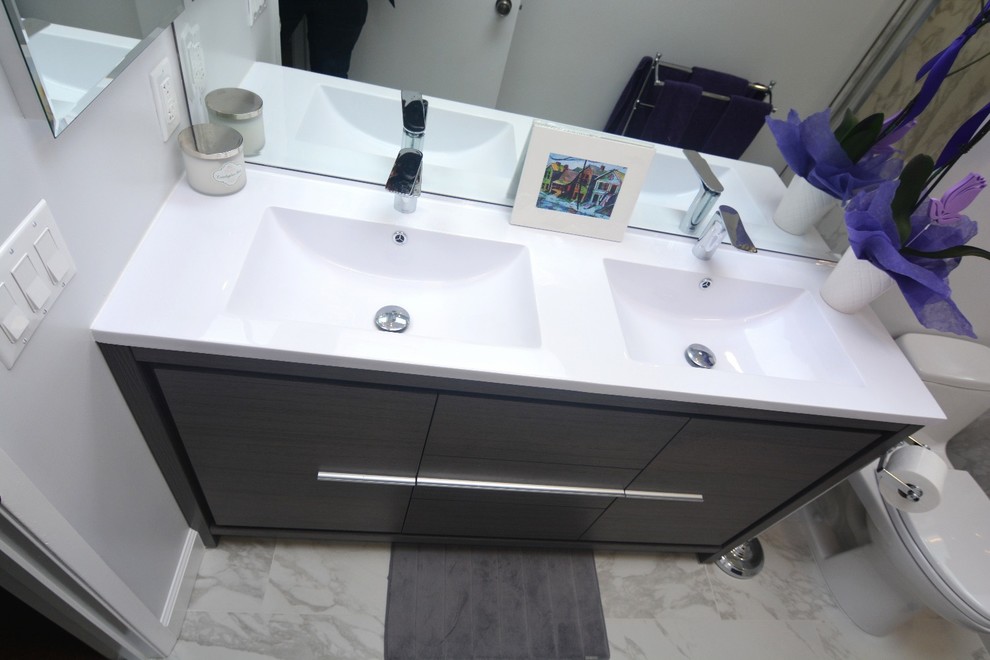 Photo of a small modern ensuite bathroom in Los Angeles with beaded cabinets, dark wood cabinets, a built-in bath, a shower/bath combination, a one-piece toilet, multi-coloured tiles, white walls, marble flooring, a built-in sink and quartz worktops.