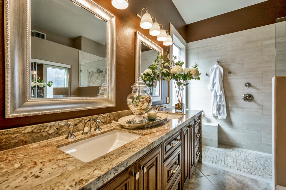 Inspiration for a medium sized traditional ensuite bathroom in Phoenix with raised-panel cabinets, brown cabinets, a walk-in shower, beige tiles, porcelain tiles, brown walls, a built-in sink, granite worktops and an open shower.
