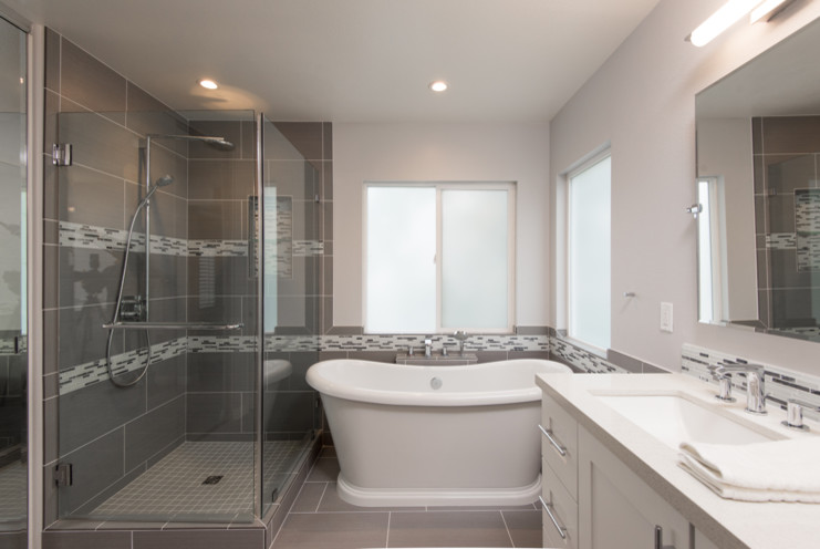 This is an example of a medium sized classic ensuite bathroom in San Diego with shaker cabinets, white cabinets, a freestanding bath, a corner shower, grey tiles, porcelain flooring, a submerged sink, engineered stone worktops, grey floors and a hinged door.