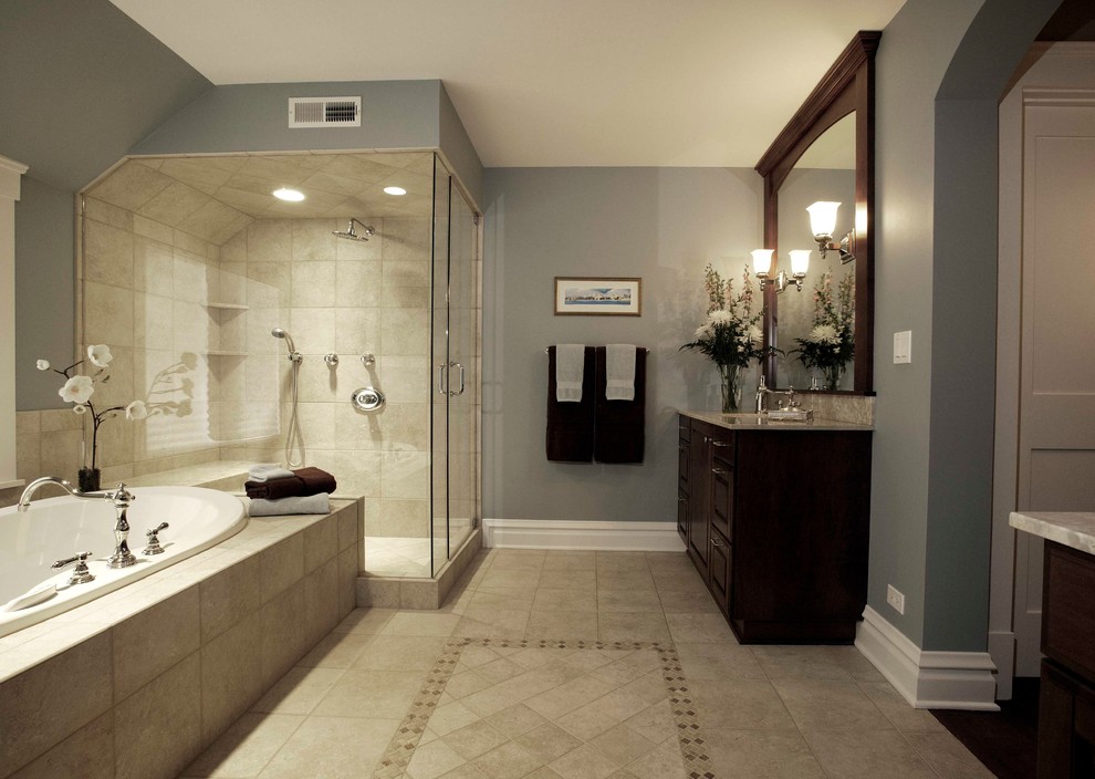 Example of a large classic master beige tile and stone tile porcelain tile bathroom design in Chicago with raised-panel cabinets, dark wood cabinets, gray walls, an undermount sink and granite countertops