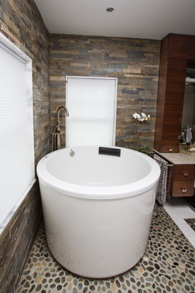Example of a trendy multicolored tile and stone tile bathroom design in Boston with a vessel sink, furniture-like cabinets, dark wood cabinets, granite countertops and a one-piece toilet