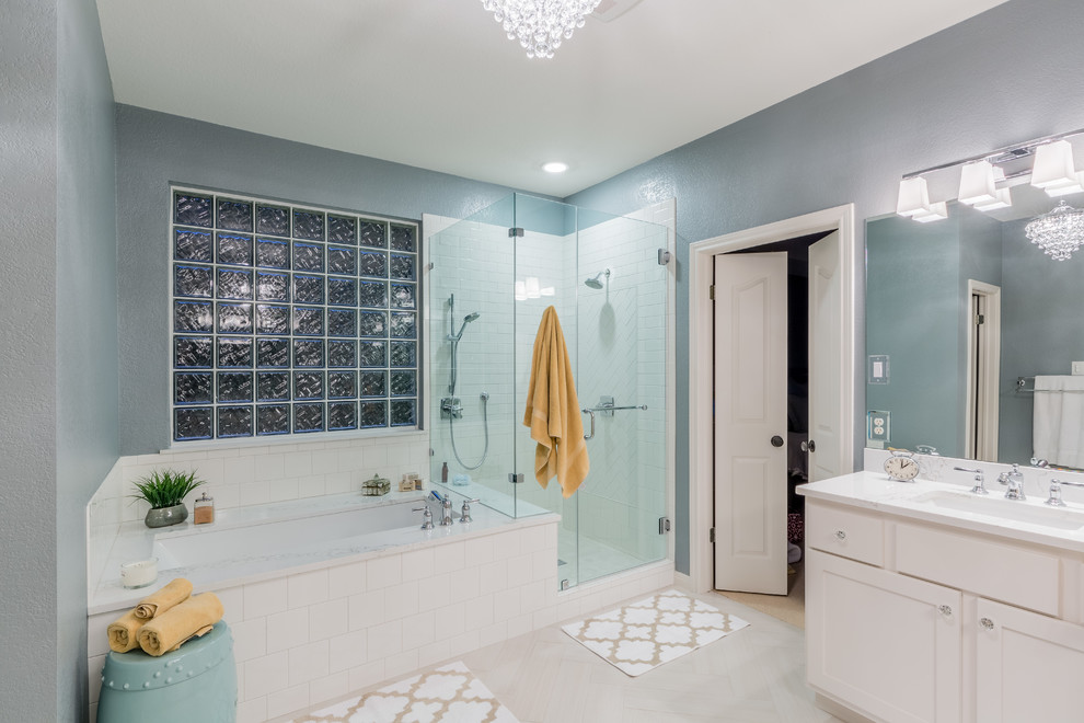 Example of a large transitional master white tile and subway tile porcelain tile bathroom design in Austin with recessed-panel cabinets, white cabinets, a two-piece toilet, gray walls, an undermount sink and quartz countertops