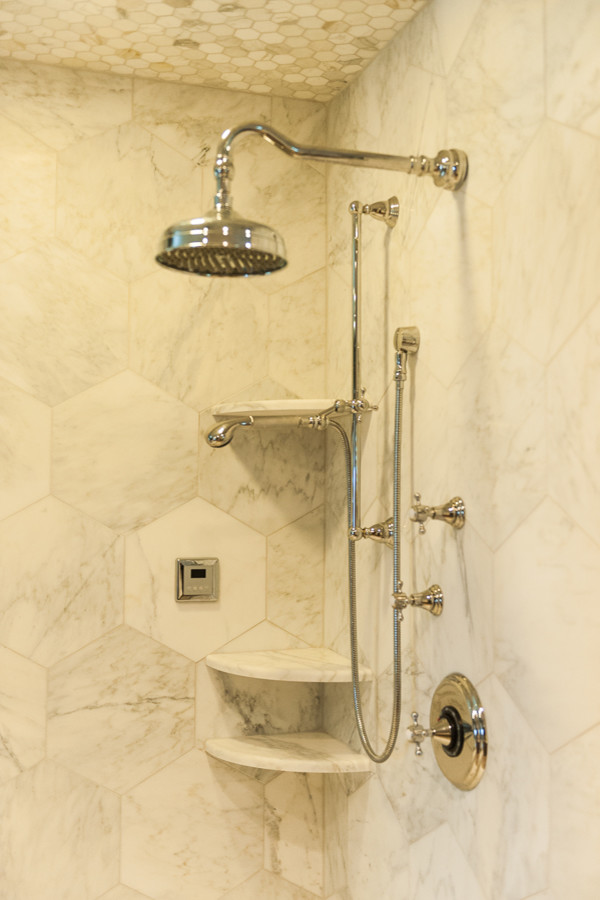 This is an example of a medium sized modern ensuite bathroom in New York with a claw-foot bath, a corner shower, marble tiles, brown walls, medium hardwood flooring and a hinged door.