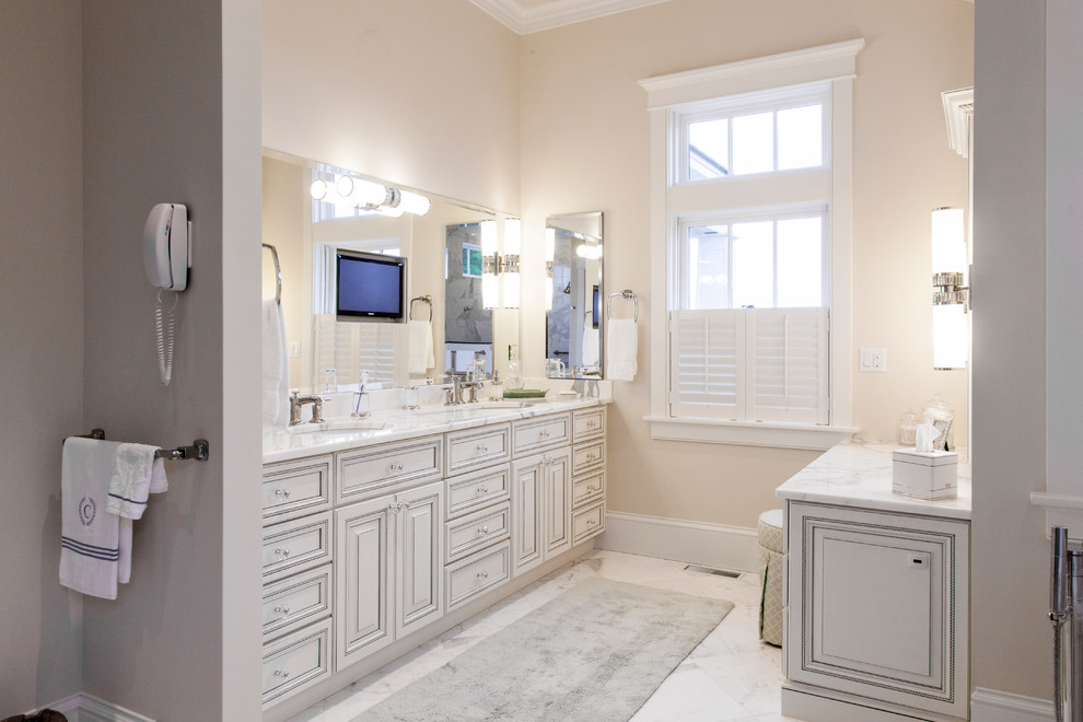 Large arts and crafts master white tile and stone tile marble floor bathroom photo in Burlington with an undermount sink, raised-panel cabinets, white cabinets, marble countertops and a two-piece toilet
