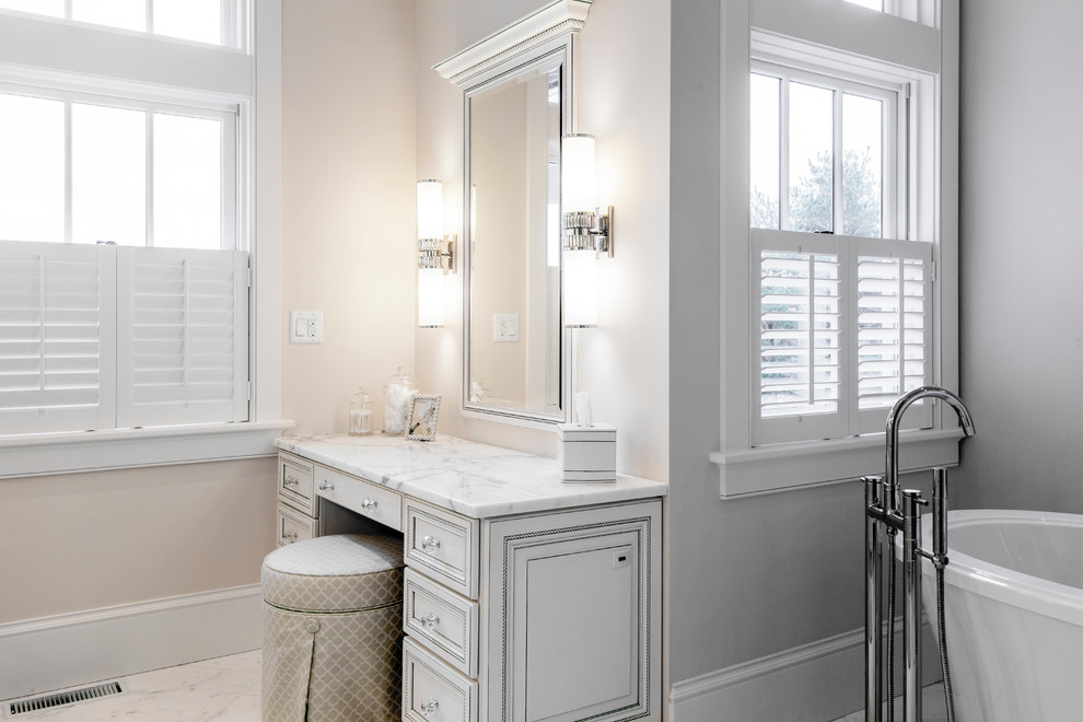 Large arts and crafts master white tile and stone tile marble floor bathroom photo in Burlington with an undermount sink, raised-panel cabinets, white cabinets, marble countertops and a two-piece toilet