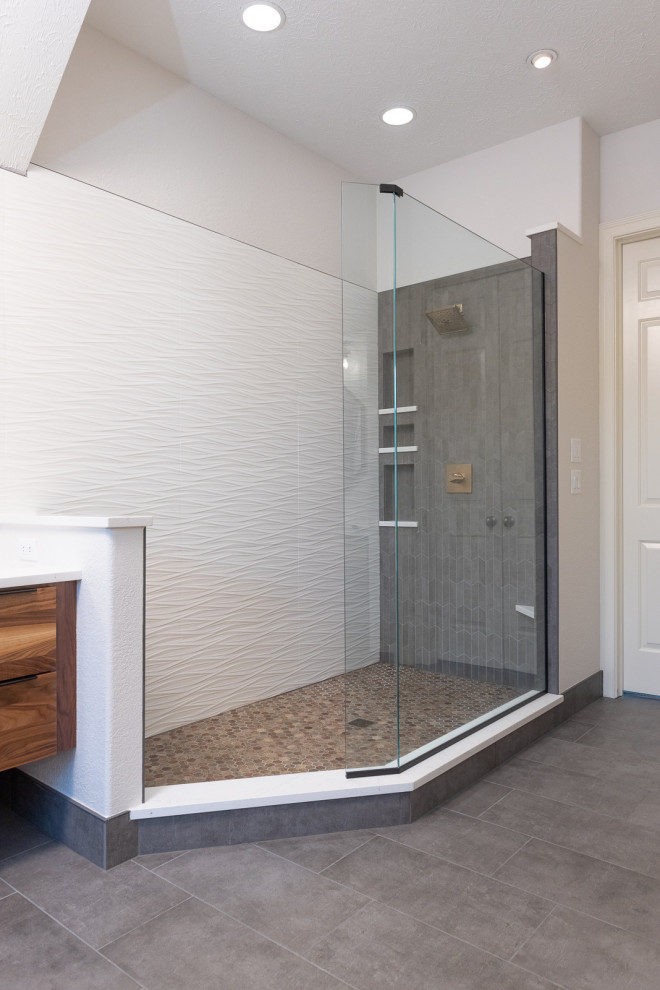 Example of a mid-sized transitional master white tile and porcelain tile ceramic tile, gray floor and double-sink bathroom design in Indianapolis with flat-panel cabinets, medium tone wood cabinets, white walls, an undermount sink, quartz countertops, white countertops, a niche and a floating vanity