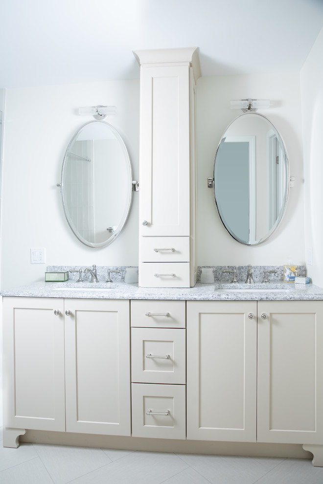 Inspiration for a medium sized classic ensuite bathroom in Portland Maine with beaded cabinets, beige cabinets, a built-in shower, a one-piece toilet, beige tiles, glass tiles, green walls, porcelain flooring, a submerged sink and engineered stone worktops.