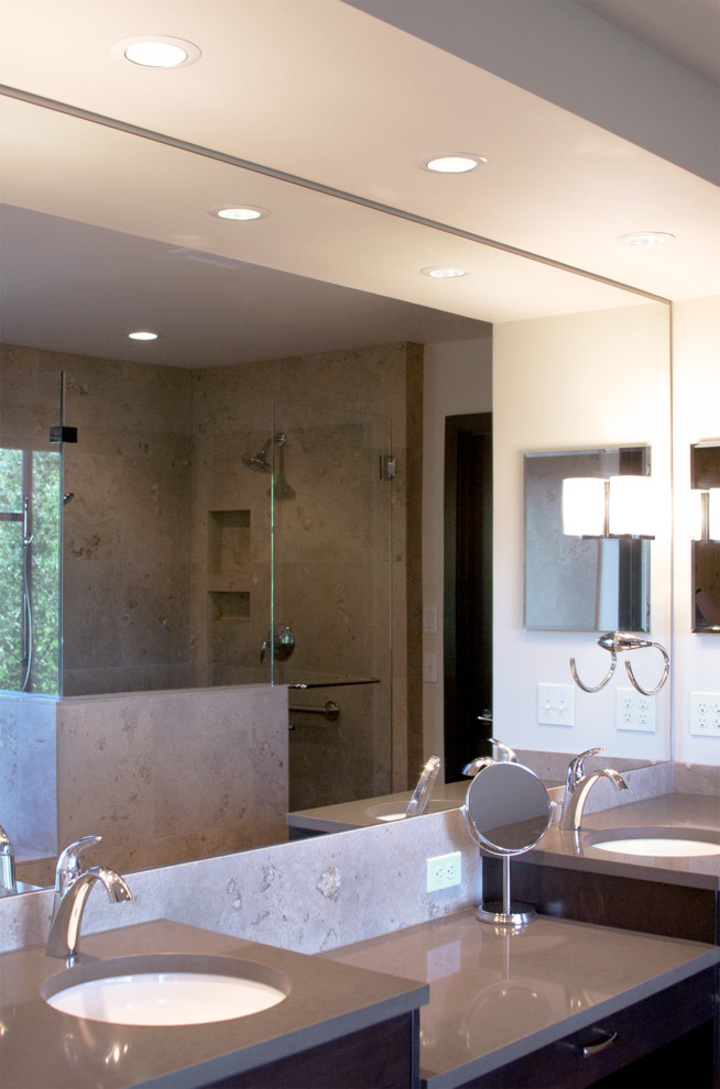Double shower - large transitional master beige tile and stone tile double shower idea in Seattle with an undermount sink, recessed-panel cabinets, dark wood cabinets, quartz countertops and white walls