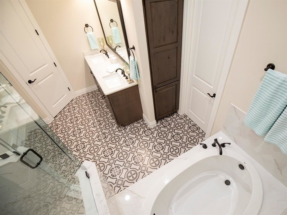 Bathroom - large mediterranean master white tile and marble tile ceramic tile and multicolored floor bathroom idea in Houston with raised-panel cabinets, gray cabinets, a two-piece toilet, beige walls, an undermount sink, marble countertops, a hinged shower door and white countertops