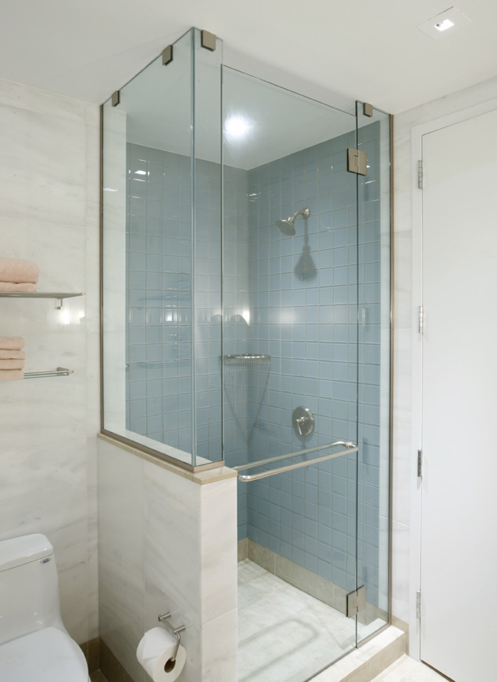 Design ideas for a small contemporary shower room bathroom in New York with marble worktops, a corner shower, a one-piece toilet, blue tiles, ceramic tiles, white walls, marble flooring, a submerged sink, flat-panel cabinets and medium wood cabinets.