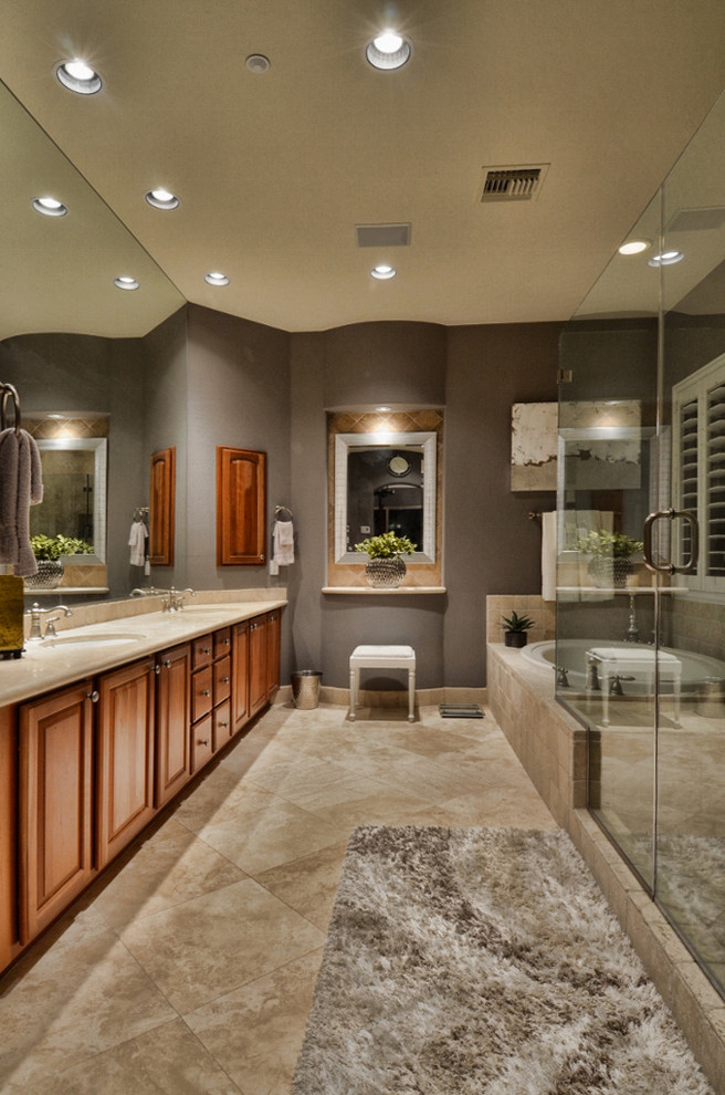 Transitional master travertine floor bathroom photo in Phoenix with raised-panel cabinets, medium tone wood cabinets and gray walls