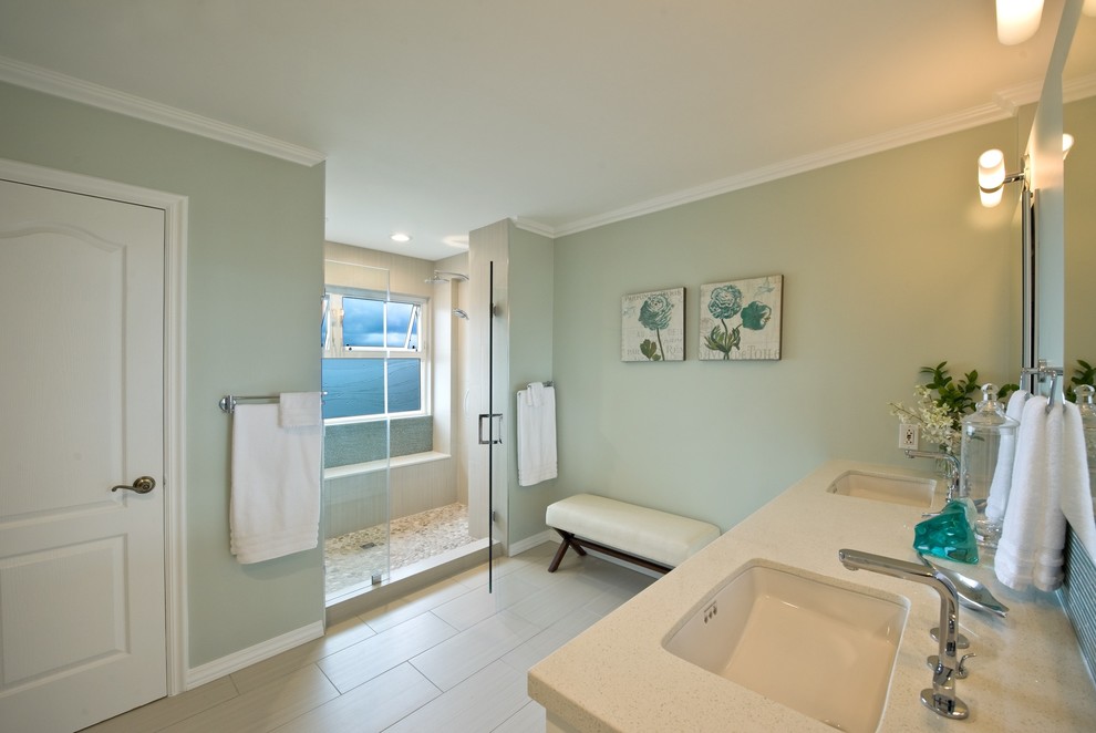 Design ideas for a large contemporary ensuite bathroom in Hawaii with white cabinets, an alcove shower, beige tiles, pebble tiles, green walls, laminate floors, a built-in sink and laminate worktops.