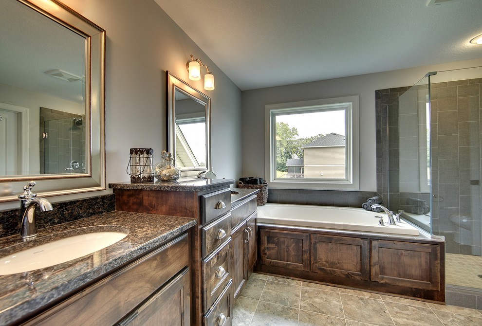 Large elegant master beige tile and ceramic tile ceramic tile bathroom photo in Minneapolis with an undermount sink, recessed-panel cabinets, dark wood cabinets, granite countertops, a one-piece toilet and gray walls
