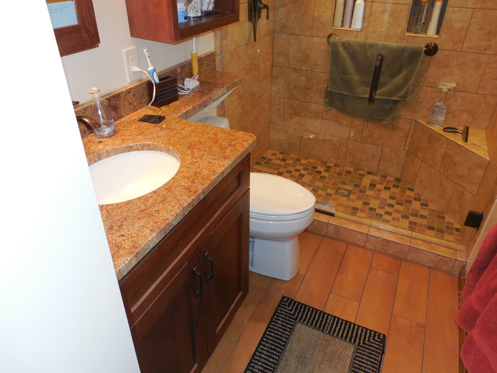 This is an example of a small traditional ensuite bathroom in Cincinnati with an alcove shower, porcelain tiles, porcelain flooring, a submerged sink and granite worktops.