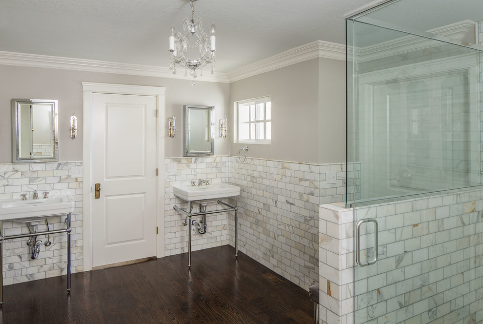 Traditional bathroom in Salt Lake City with a console sink, white tiles, stone tiles and feature lighting.