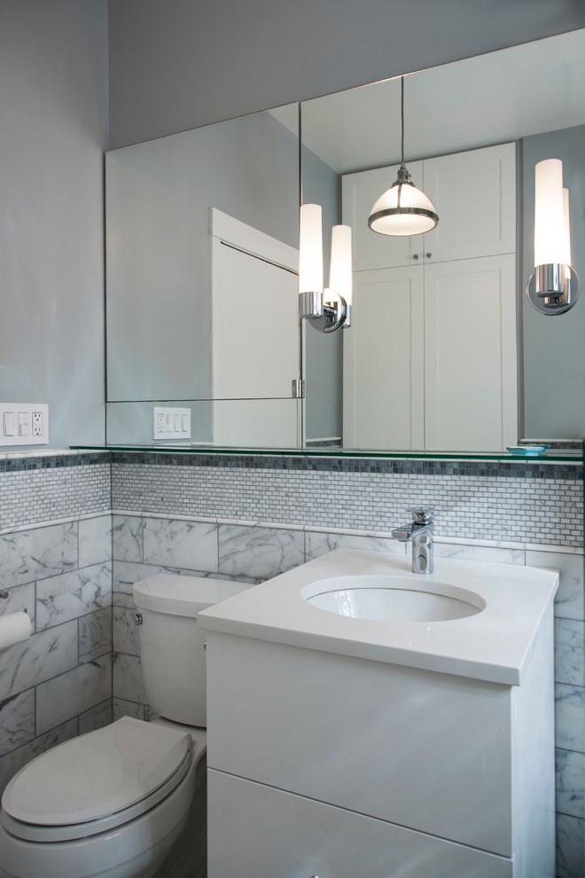 Inspiration for a mid-sized transitional master gray tile and stone tile marble floor bathroom remodel in Chicago with shaker cabinets, white cabinets, a two-piece toilet, gray walls, an undermount sink and quartz countertops