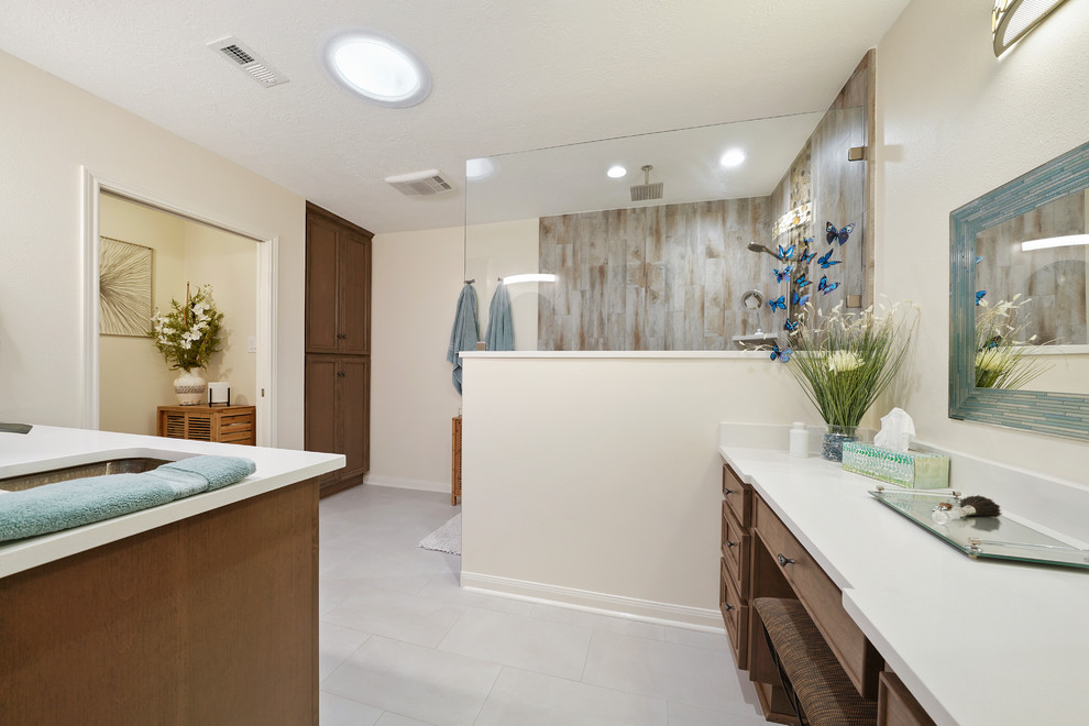 Mid-sized trendy master white tile and pebble tile bathroom photo in Houston with recessed-panel cabinets, light wood cabinets, a two-piece toilet, an undermount sink, quartz countertops and white countertops