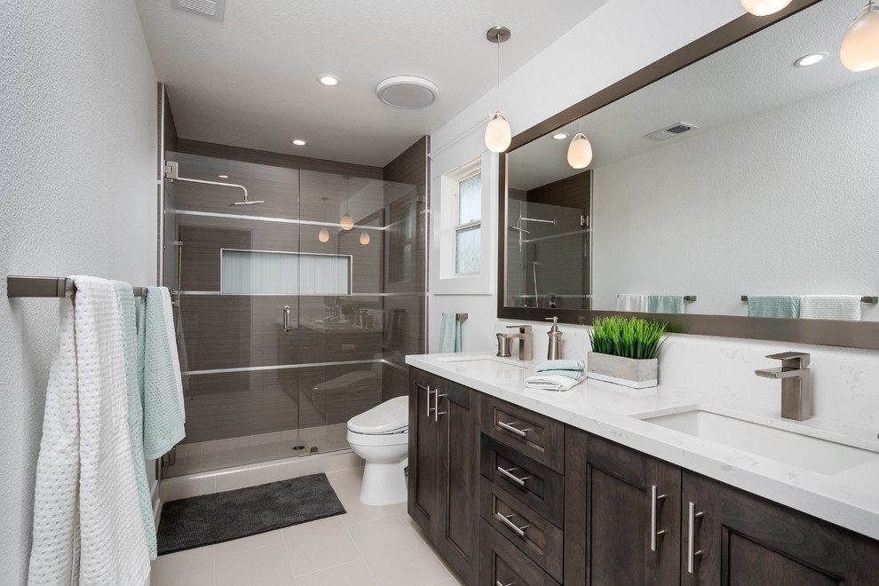 Mid-sized minimalist master brown tile and ceramic tile ceramic tile and beige floor alcove shower photo in San Francisco with shaker cabinets, brown cabinets, a bidet, white walls, an undermount sink, quartz countertops and a hinged shower door