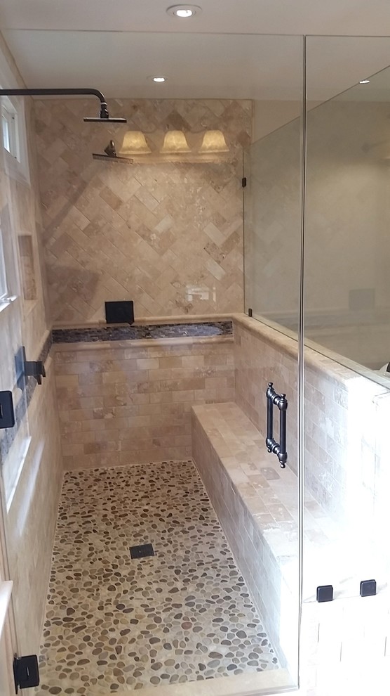 Freestanding bathtub - mid-sized traditional master beige tile and stone tile travertine floor freestanding bathtub idea in DC Metro with a vessel sink, dark wood cabinets, granite countertops and beige walls