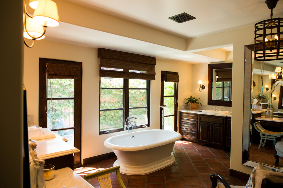 Huge transitional master terra-cotta tile bathroom photo in Los Angeles with a drop-in sink, raised-panel cabinets, medium tone wood cabinets, marble countertops, a one-piece toilet and beige walls