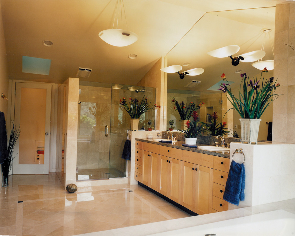 Example of a large trendy master beige tile and stone tile marble floor and beige floor bathroom design in San Francisco with a drop-in sink, shaker cabinets, light wood cabinets, granite countertops, a two-piece toilet, beige walls, a hinged shower door and brown countertops