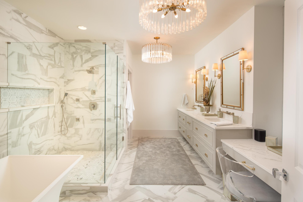 Large contemporary ensuite bathroom in Atlanta with grey cabinets, a freestanding bath, a corner shower, a submerged sink, engineered stone worktops, a hinged door, multi-coloured tiles, white walls, multi-coloured floors and white worktops.